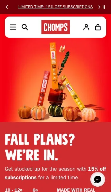 Chomps homepage on a 375 by 650 phone screen: a 15% off subscriptions bar, the fall hero with sticks on pumpkins, Fall plans? We're in., and a chat bubble over the end of the hero copy