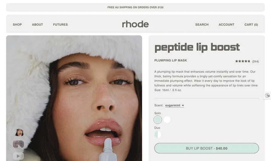 rhode peptide lip boost page on the Australian store, opened from a US connection: a bar reading free AU shipping on orders over $120 and a Buy lip boost button at $40.00