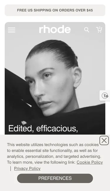 rhode homepage on a 375 by 650 phone screen: a free US shipping bar, a black and white portrait, the headline cut off at Edited, efficacious, and a cookie banner covering the bottom of the screen