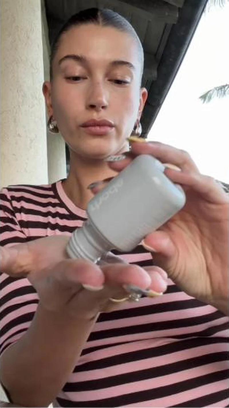 With button, video poster frame tilting a Glazing Milk bottle to camera